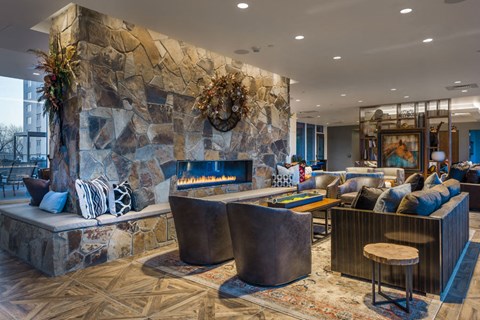 a living room with a fireplace and couches