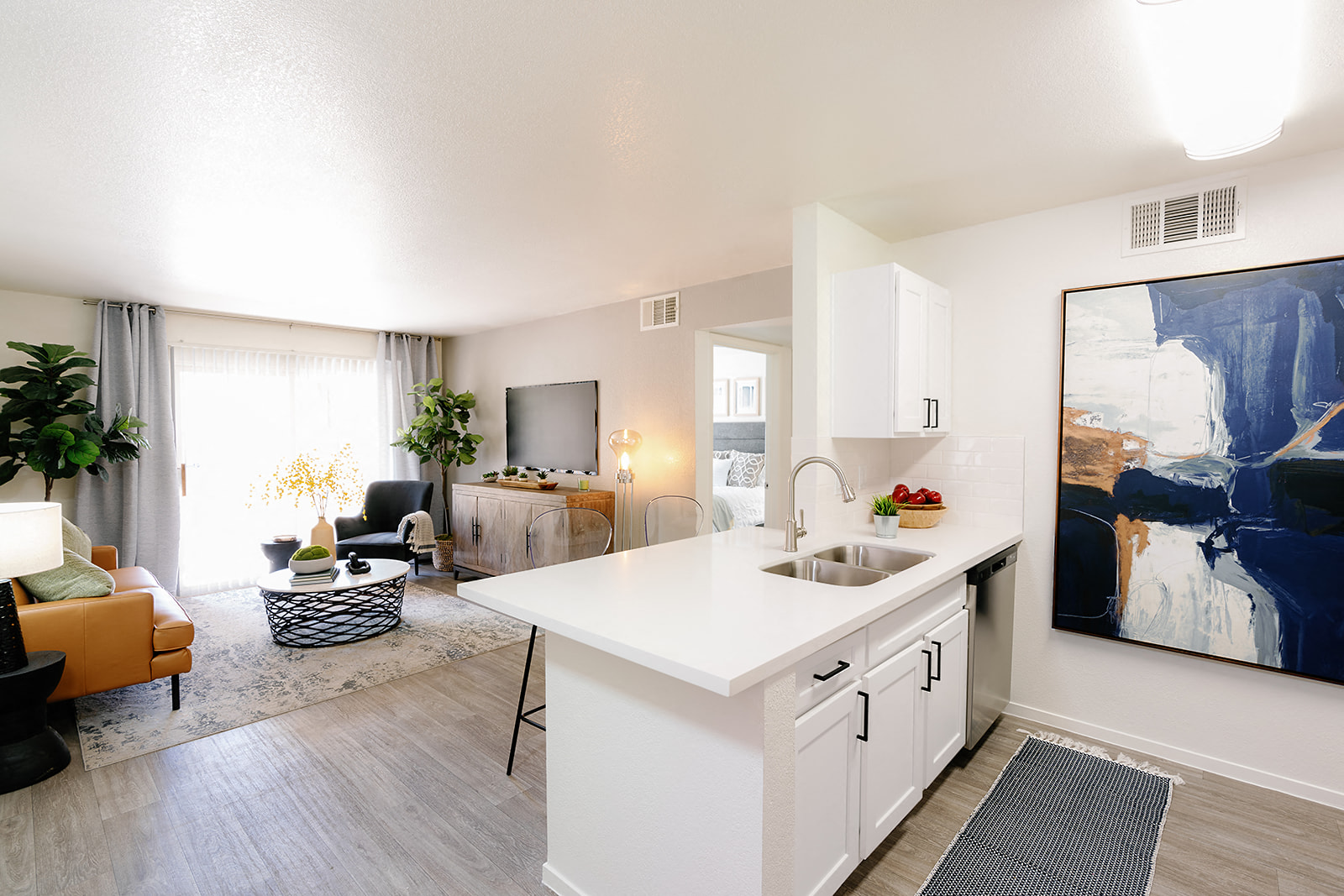 an open floor plan with a kitchen and living room