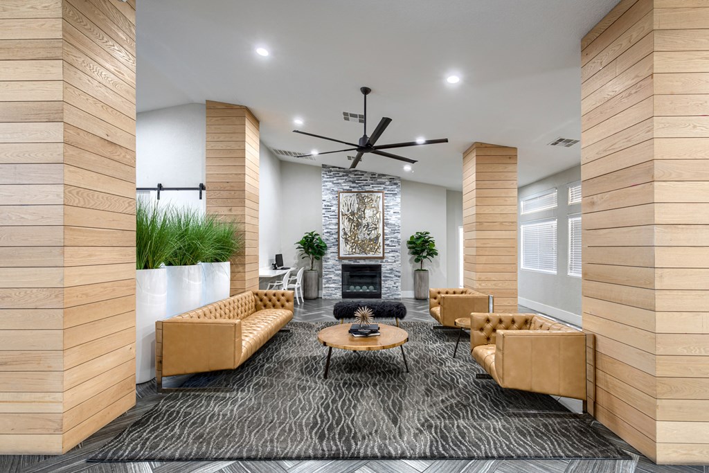 a living room with couches and a fireplace