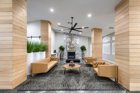 a living room with couches and a fireplace