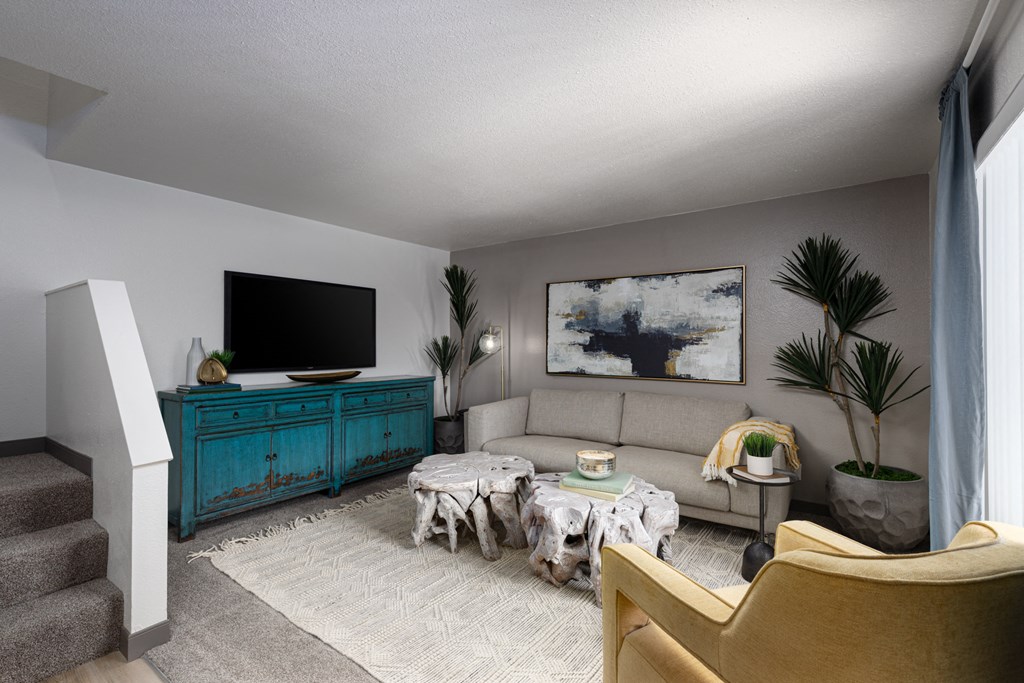 a living room with a couch and a tv