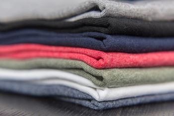 Laundry folded in a neat pile at Hobart Apartments, California, 90029