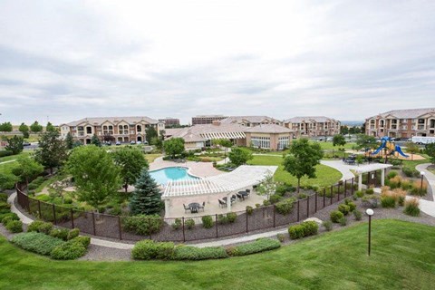 an aerial view of a resort with a swimming pool
