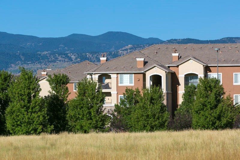 a large house in the middle of a field