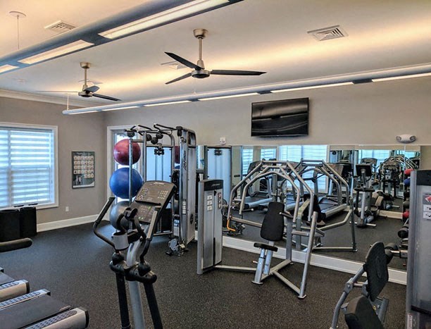 a gym with a lot of exercise equipment