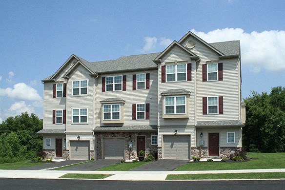a large house with a street in front of it