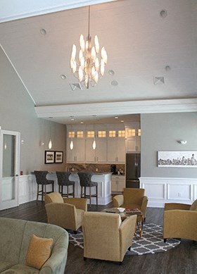 a view of the living room and kitchen from the dining room