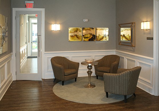a living room with two chairs and a table