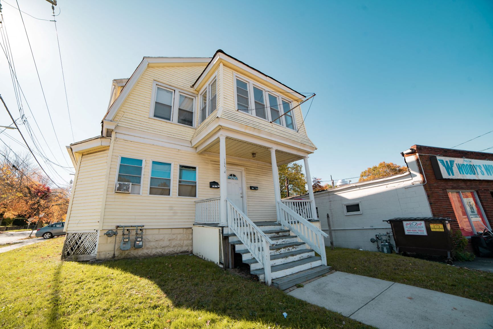 A two-story house with a white front porch.