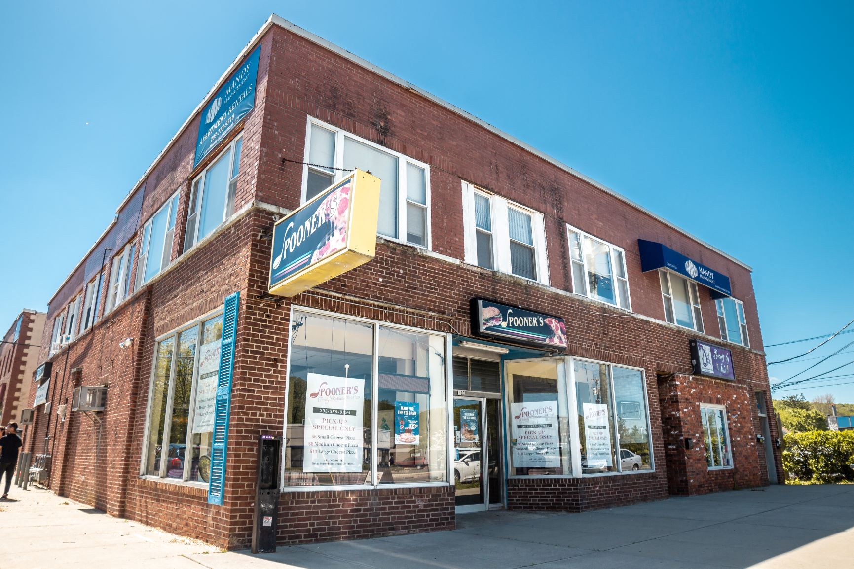 A brick building with a sign that says Powers.