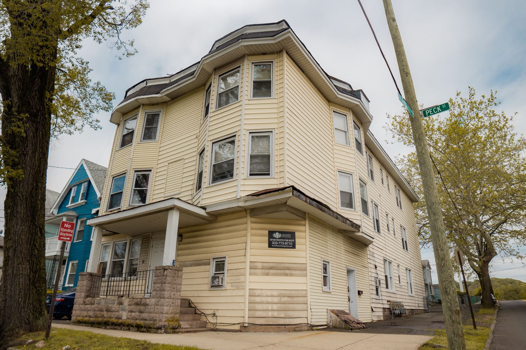 A two-story building with a balcony on the second floor.