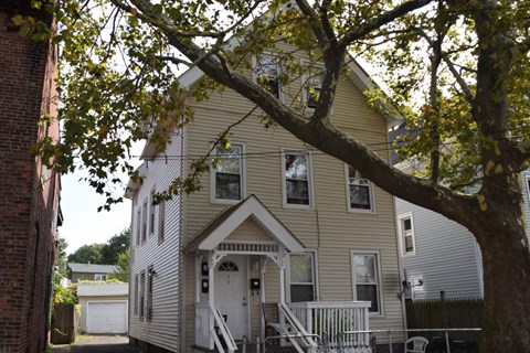 A house with a white door and a porch.
