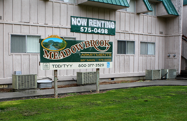 a sign in front of a building