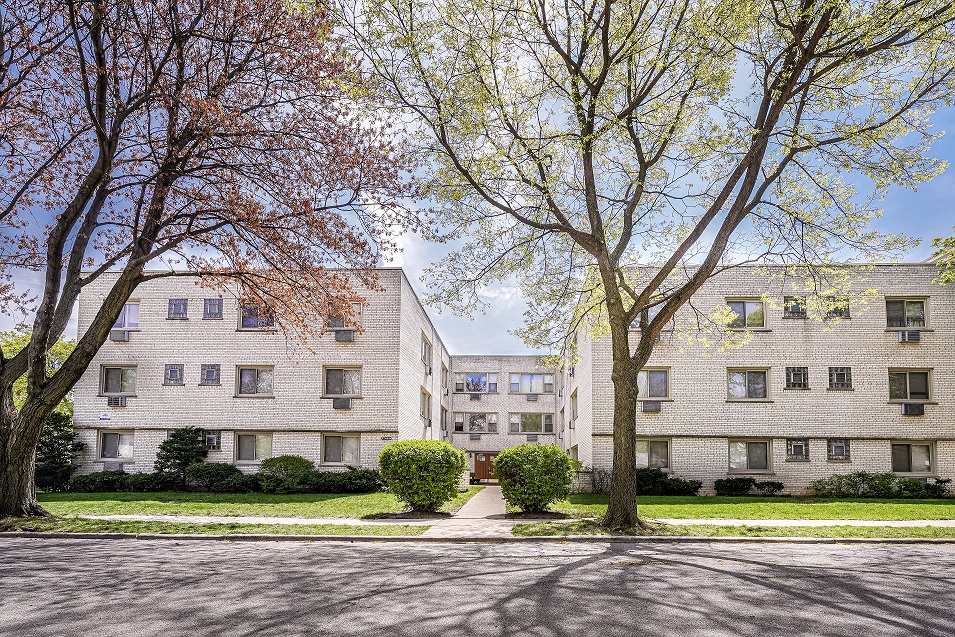 our apartments are located in a quiet neighborhood with trees and grass