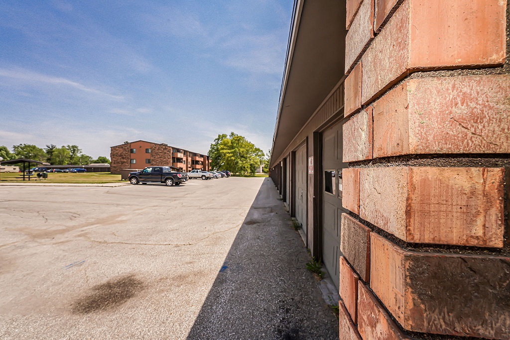 the side of a building with a parking lot