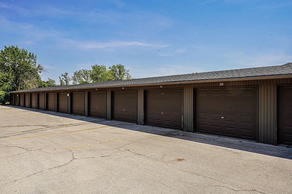 a row of garage doors on the side of a building