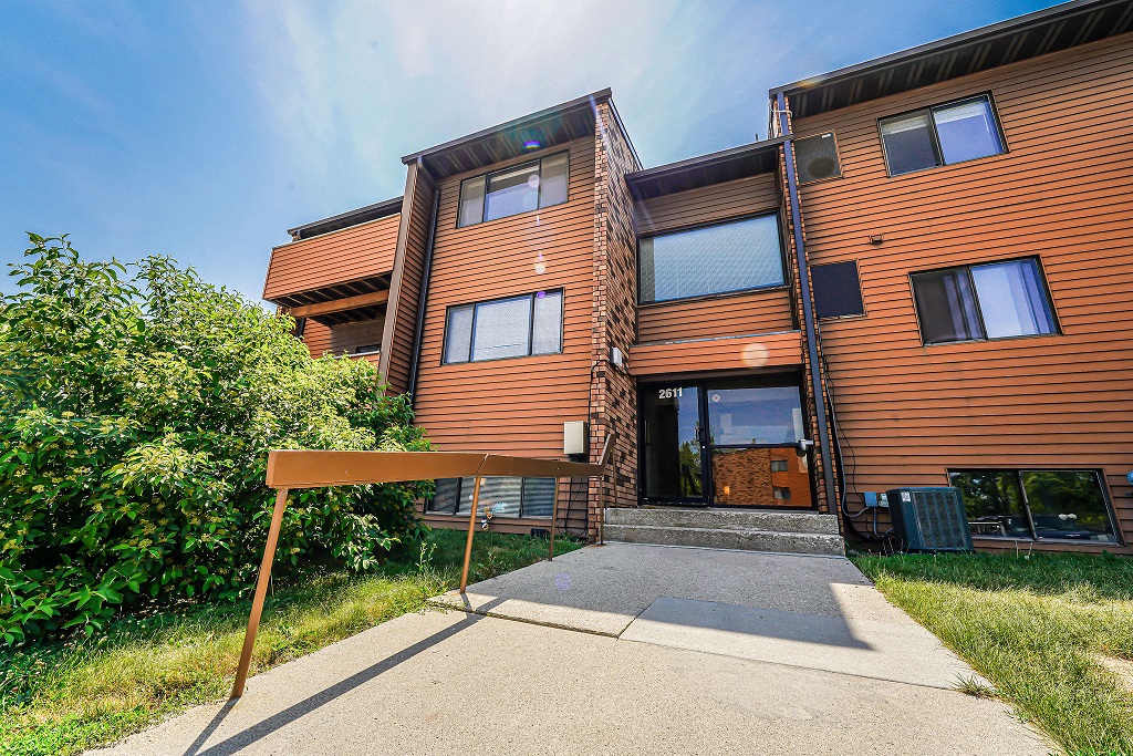 the front of a building with a sign in front of it