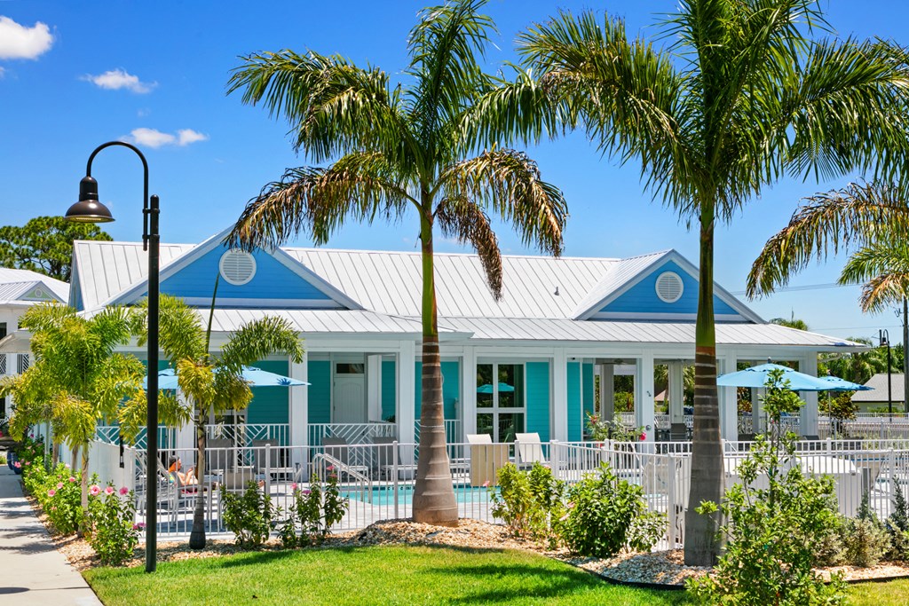 a house with palm trees in front of it