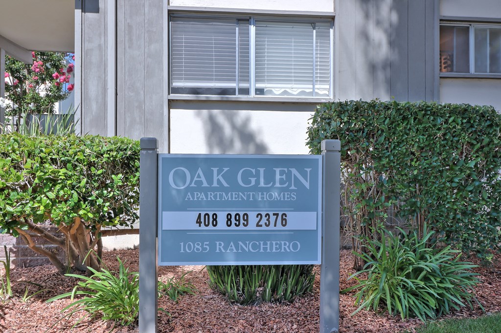 an apartments sign in front of a building