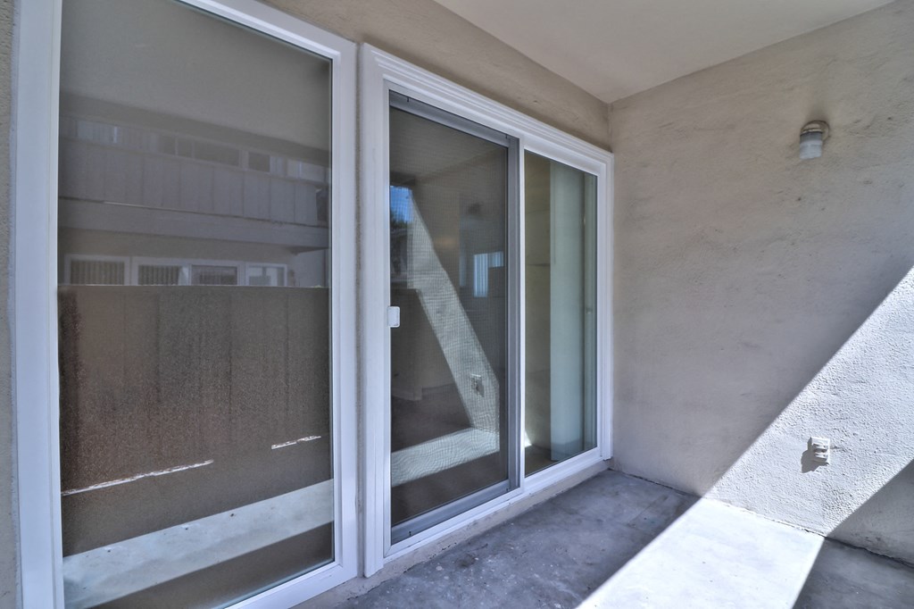 a sliding glass door on the side of a building