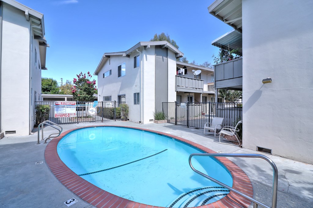 the swimming pool at the falls apartments
