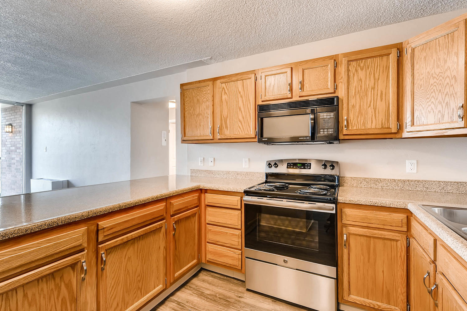 Our Apartment Kitchen with Stone Countertop at Scandia Apartments in Englewood, Colorado