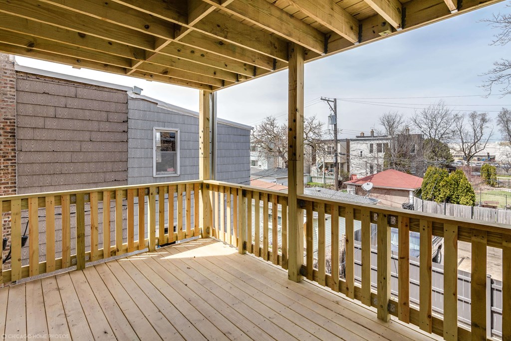 the deck of a home with a view of the city