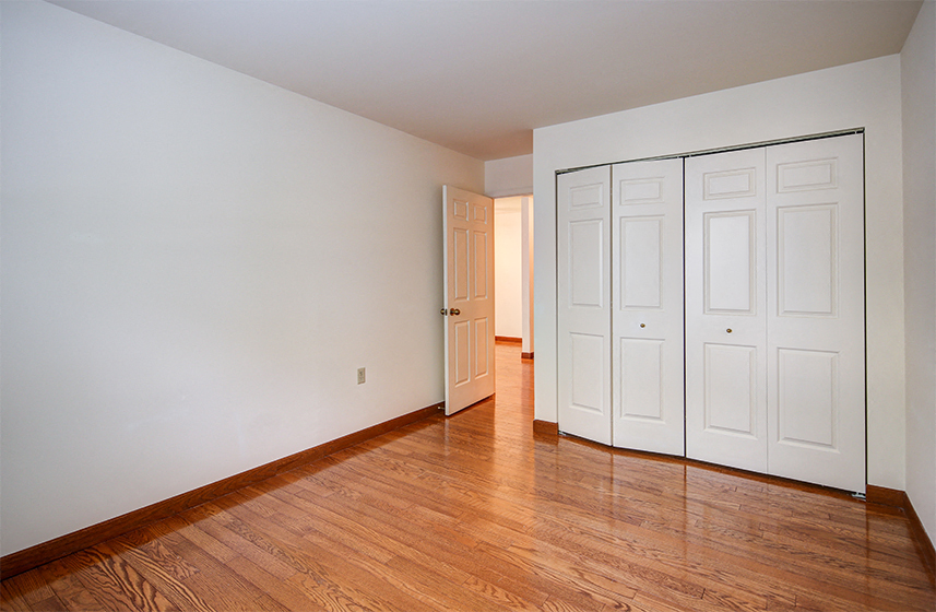 Two Bedroom Apartment Style Guest Bedroom Closet at Lake Oaks Apartments