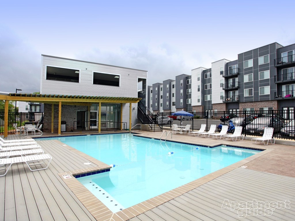 a swimming pool at an apartment building with a pool