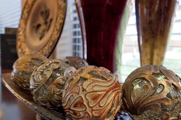 a group of shells on a table next to a mirror