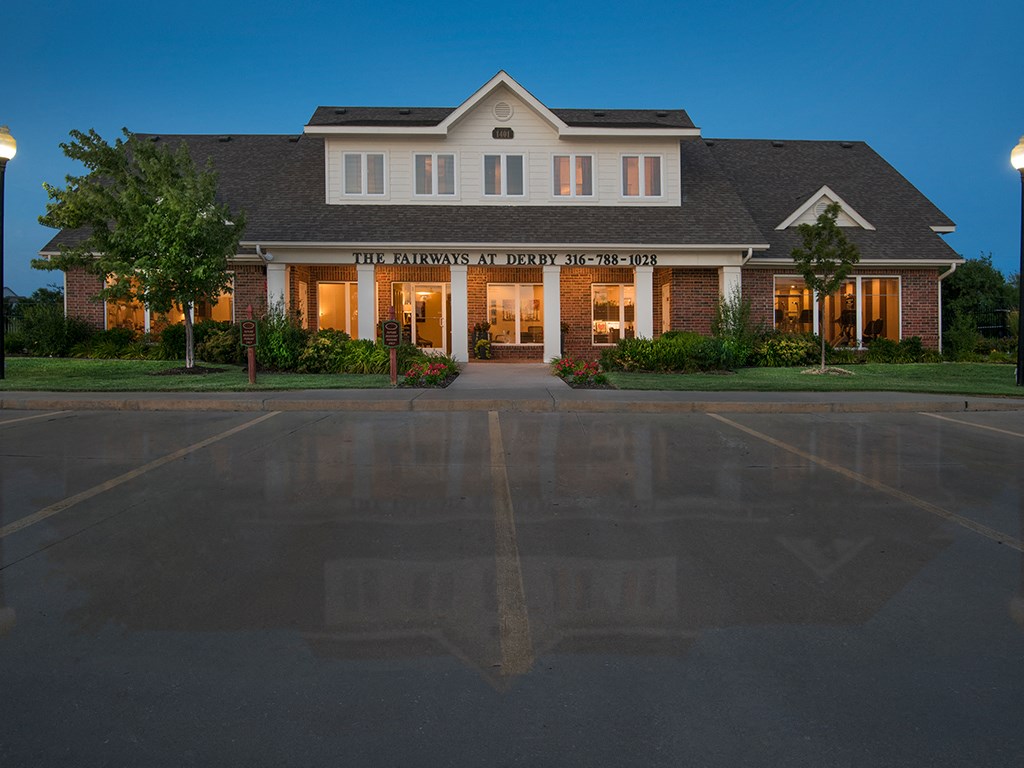 a view of the front of a large house at night