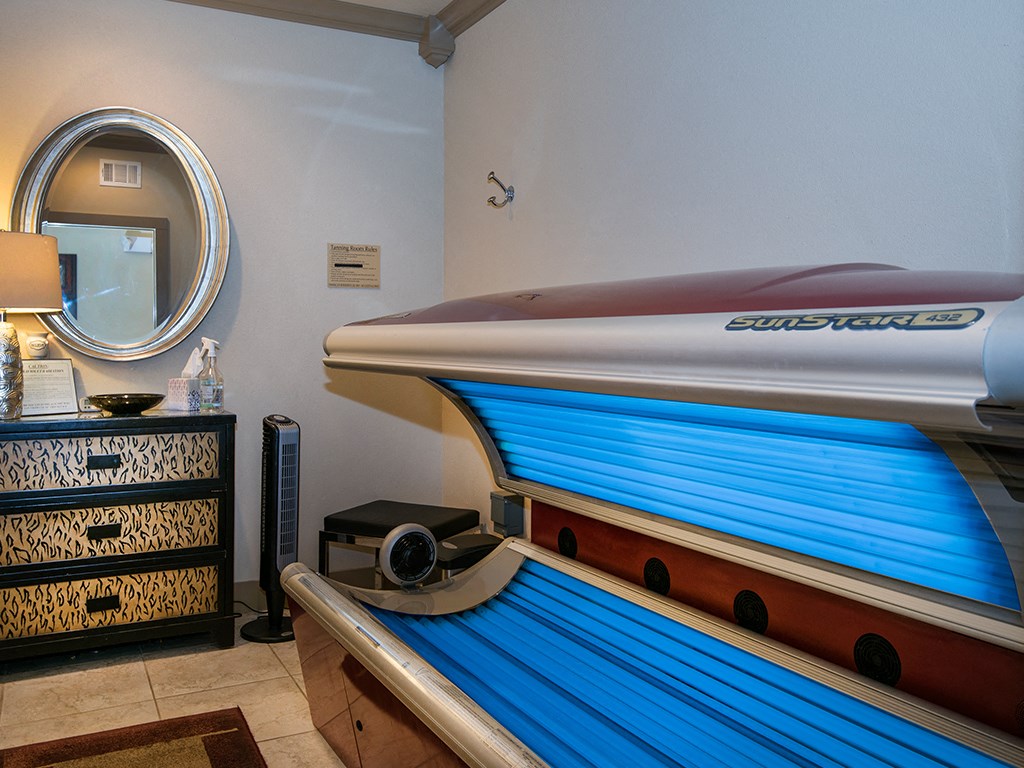 a spa room with a pool table and a surfboard