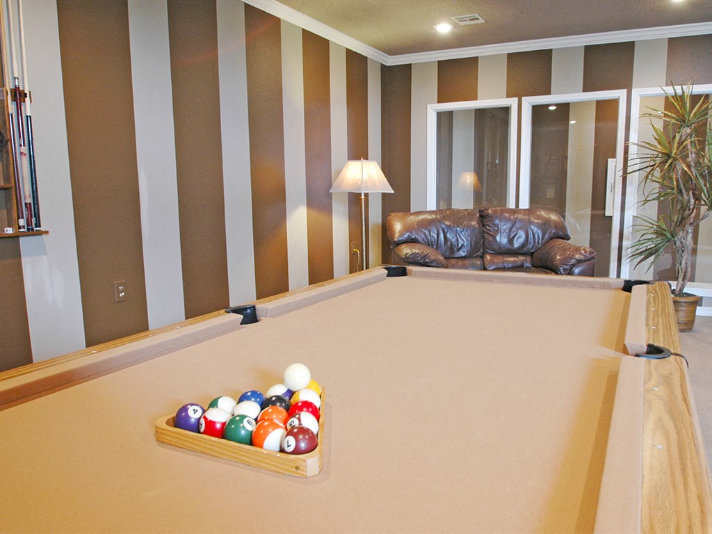 a game room with a pool table