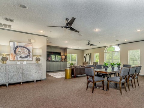 a dining room with a table and chairs