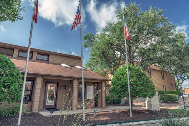 a building with two flags in front of it