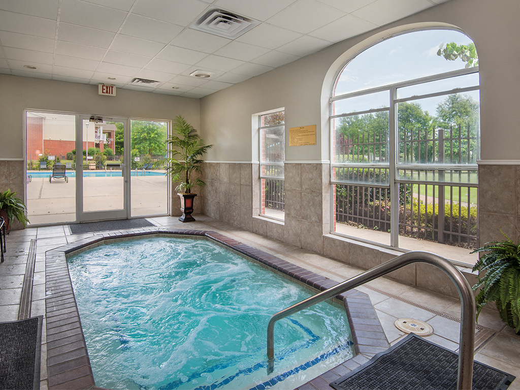 a spa with a pool and a large window