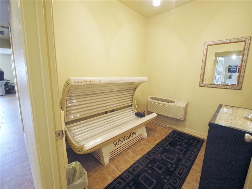 a sauna bench in a room with a mirror