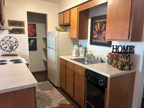 a kitchen with a sink and a refrigerator