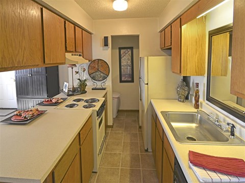 a kitchen with a sink and a refrigerator