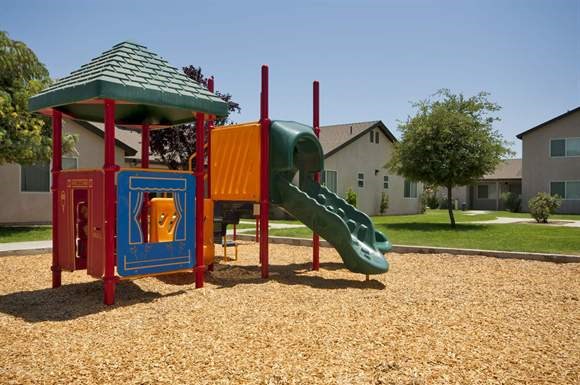 a childrens playground with a slide