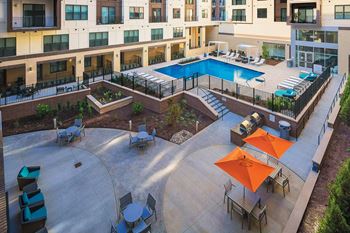 Garden Courtyard with Grills and Fireplace at The Edison Lofts Apartments, North Carolina