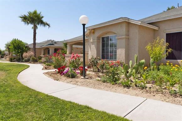 a sidewalk in front of a house