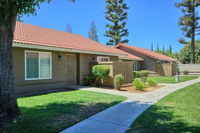 a house with a sidewalk in front of it