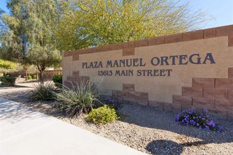 a stone sign with the words plaza manuel ortega on it