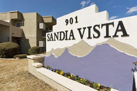 a sign that says sandia vista in front of a building