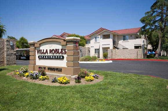 a view of the villa rosellas apartments sign in front of the building