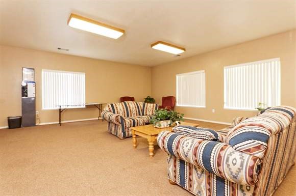 a living room with two couches and a table