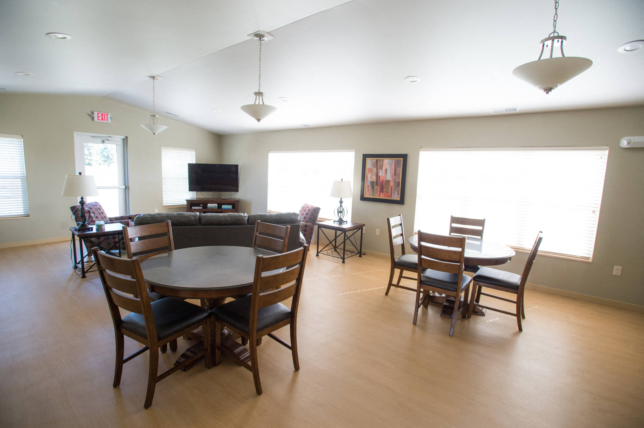 a dining room and living room with a table and chairs