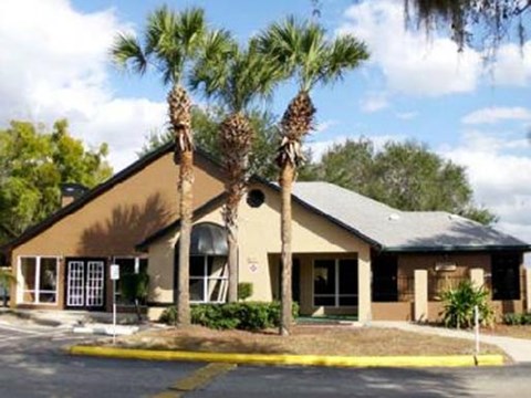 a building with palm trees in front of it