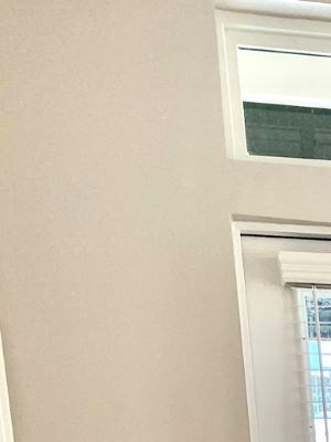 Dining room in front of balcony doorway in Newberry, FL apartment at The Flats at Tioga Town Center